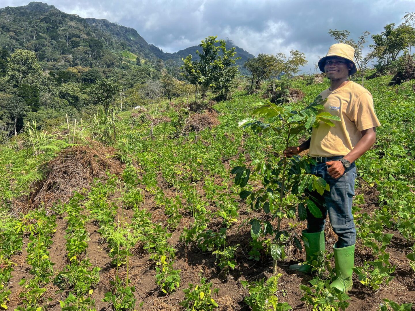 Richard and one year old Khaya in farm with beans